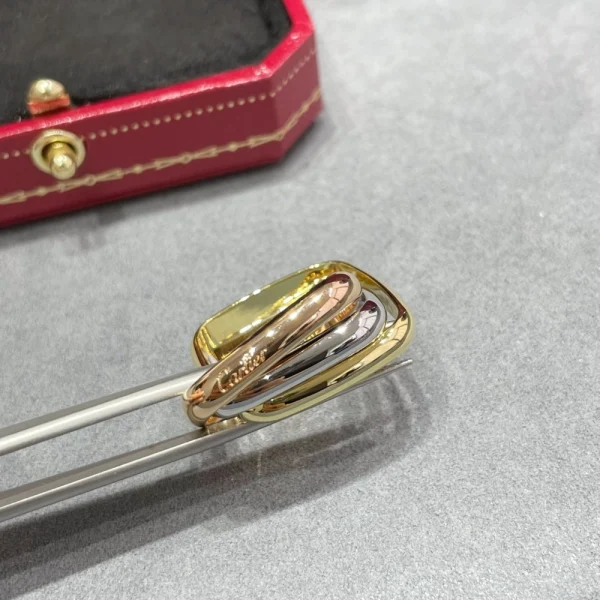 Cartier Trinity Cushion ring – Unique three-gold luxury ring with curved design by GodJewel