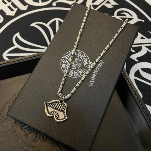 Chrome Hearts gold teeth mouth necklace featuring bold pendant design and luxury streetwear style.