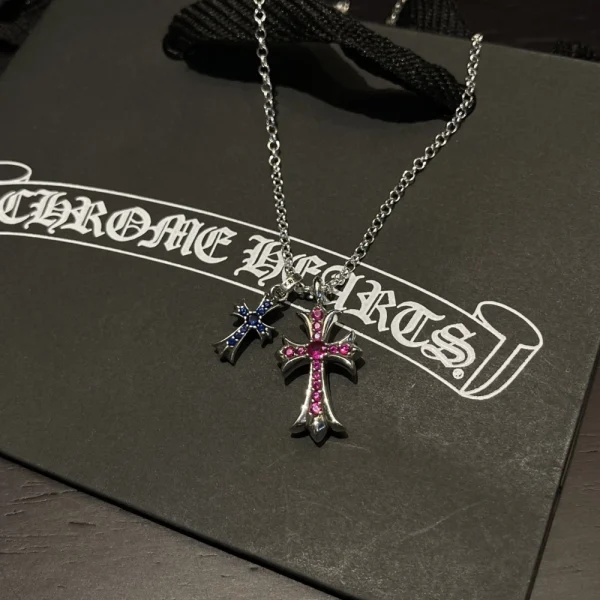 Sterling silver Chrome Hearts necklace with two cross pendants, showcasing signature handcrafted detail.