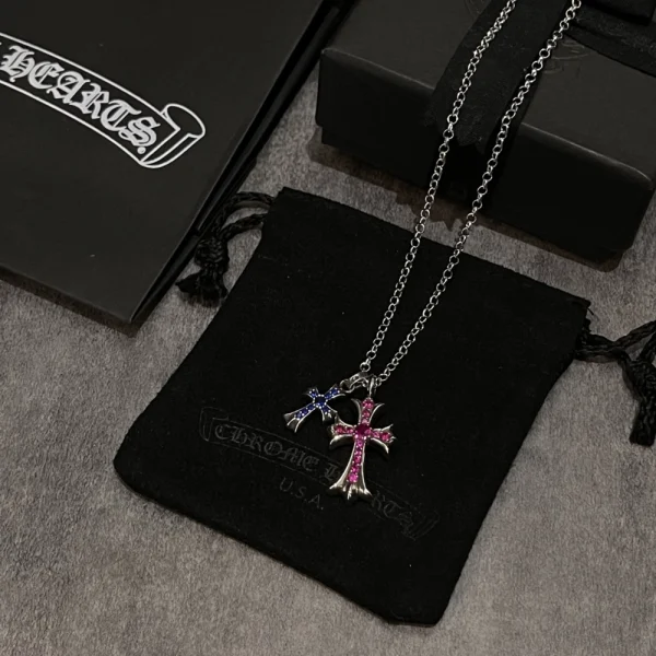 Chrome Hearts silver double cross necklace featuring layered gothic-style pendants and bold design.