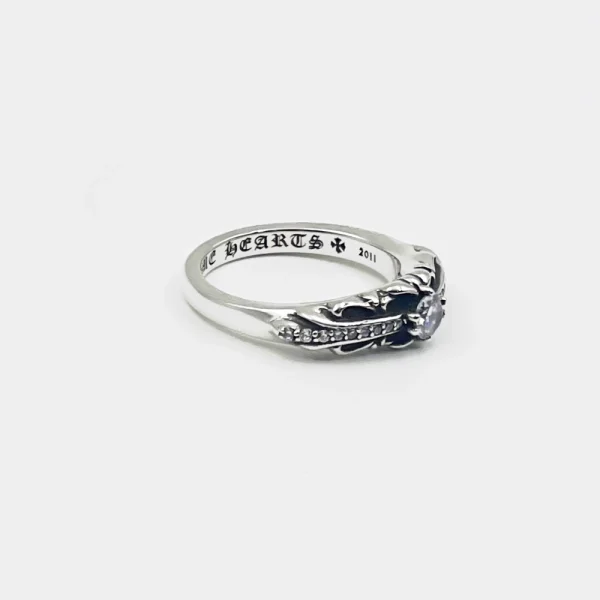 Elegant Chrome Hearts Baby Floral ring adorned with black diamonds, combining luxury and edgy floral detailing.