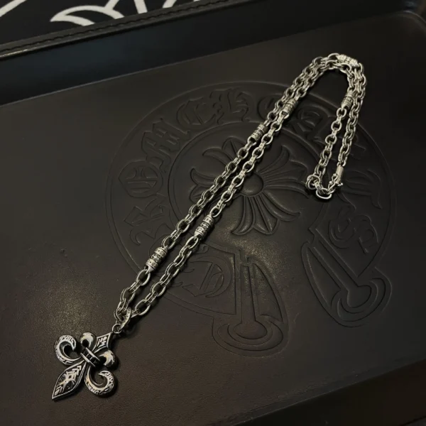 Chrome Hearts BS Fleur charm necklace in sterling silver with gothic fleur-de-lis motif.