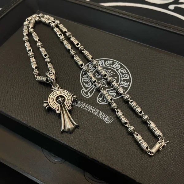 Sterling silver Chrome Hearts Crosby Heart Horseshoe pendant with detailed gothic craftsmanship.