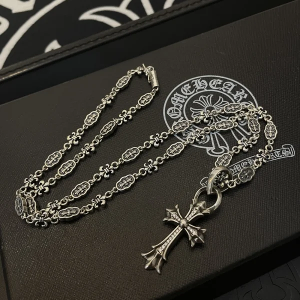 Chrome Hearts cross charm necklace in sterling silver with gothic-inspired detailing.