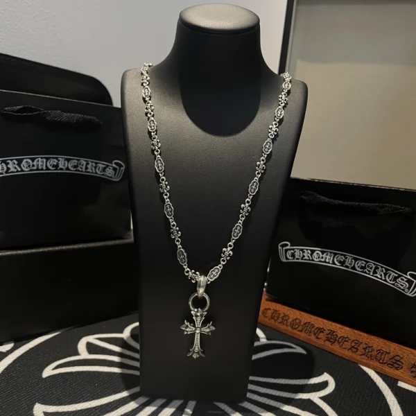 Sterling silver Chrome Hearts necklace featuring iconic cross charm and handcrafted finish.