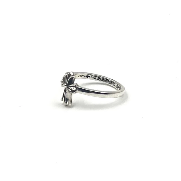 Sterling silver Chrome Hearts ring with signature cross motif, iconic luxury streetwear accessory.