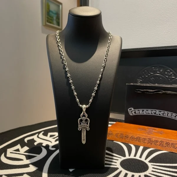 Chrome Hearts double dagger pendant necklace in sterling silver with gothic-style detailing.