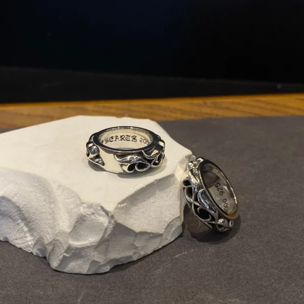 Sterling silver Chrome Hearts ring with continuous eternity vine pattern, handcrafted luxury jewelry.