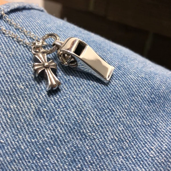 Sterling silver Chrome Hearts necklace featuring delicate filigree cross charm and handcrafted design.