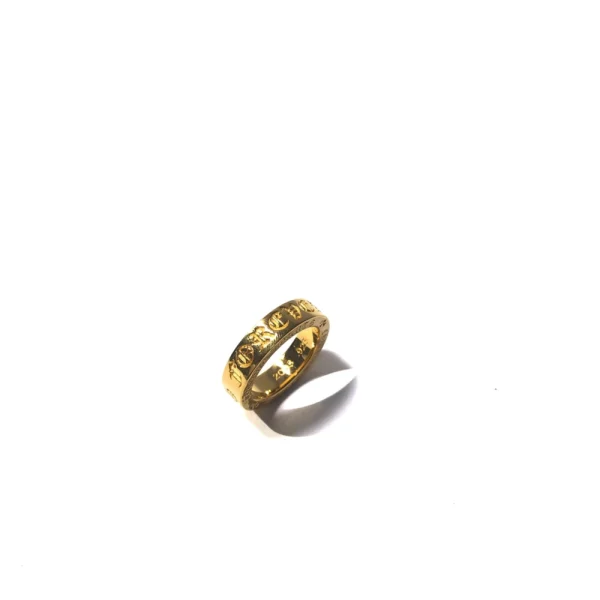Chrome Hearts Forever ring in gold with engraved gothic lettering and polished luxury finish.