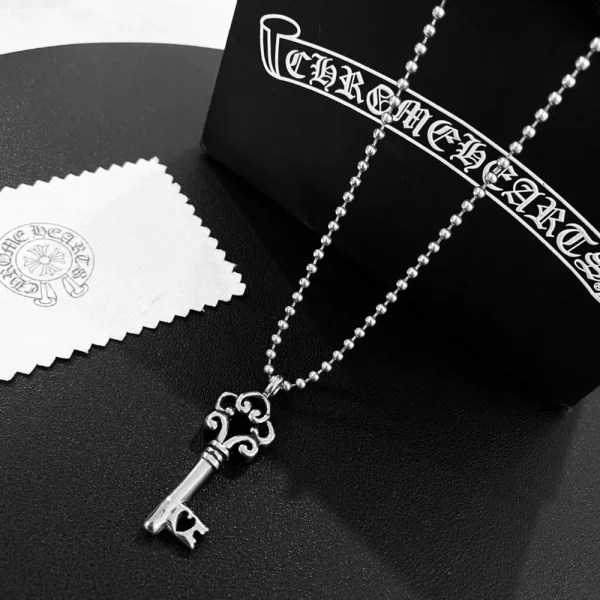 Chrome Hearts key pendant necklace in sterling silver with intricate gothic design.
