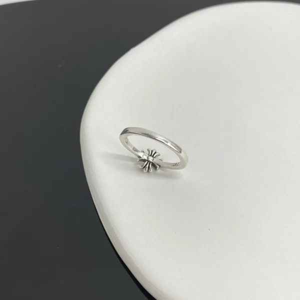 Sterling silver Chrome Hearts ring featuring Maltese Cross motif and thick bubblegum-style band.