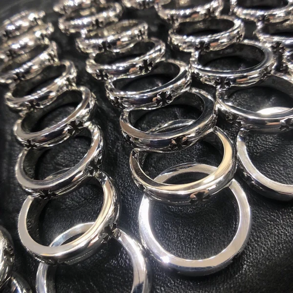 Edgy Chrome Hearts Plus Cutout ring, luxury silver jewelry combining minimalist cuts with iconic motifs.