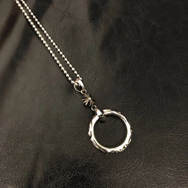 Chrome Hearts ring necklace in sterling silver featuring bold gothic design and iconic craftsmanship.