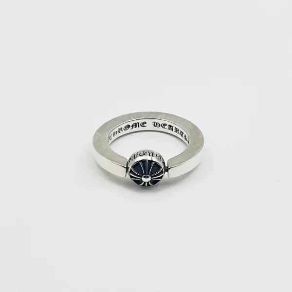 Rotating Chrome Hearts cross band ring in sterling silver with engraved gothic crosses and spinning center.