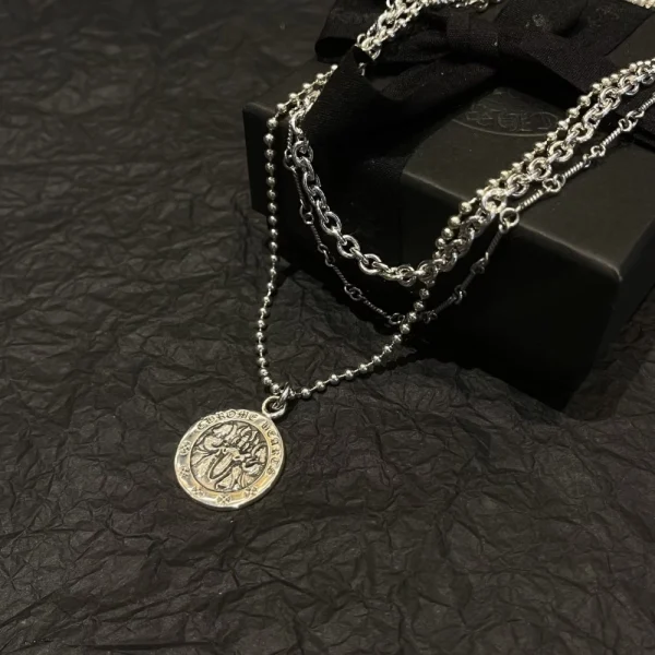 Luxury Chrome Hearts angel medallion necklace with round pendant design and handcrafted silver finish.