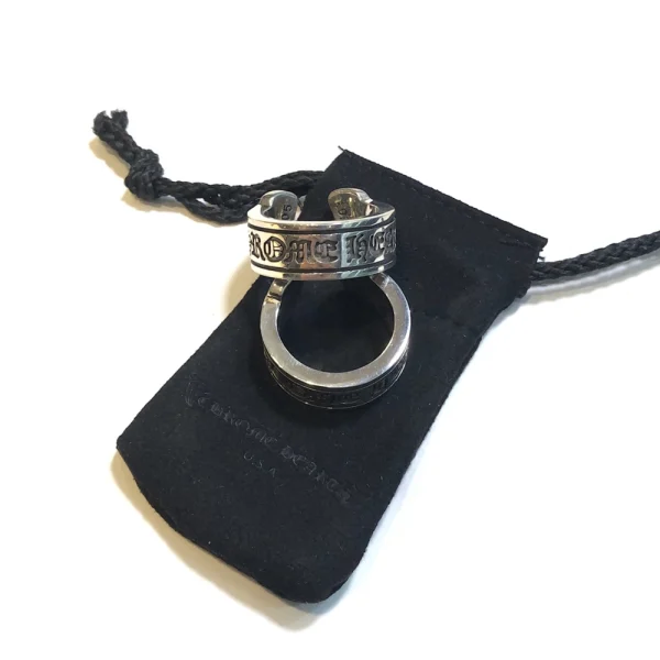 Chrome Hearts Scroll Label ring in sterling silver featuring engraved scroll-style branding and gothic detailing.