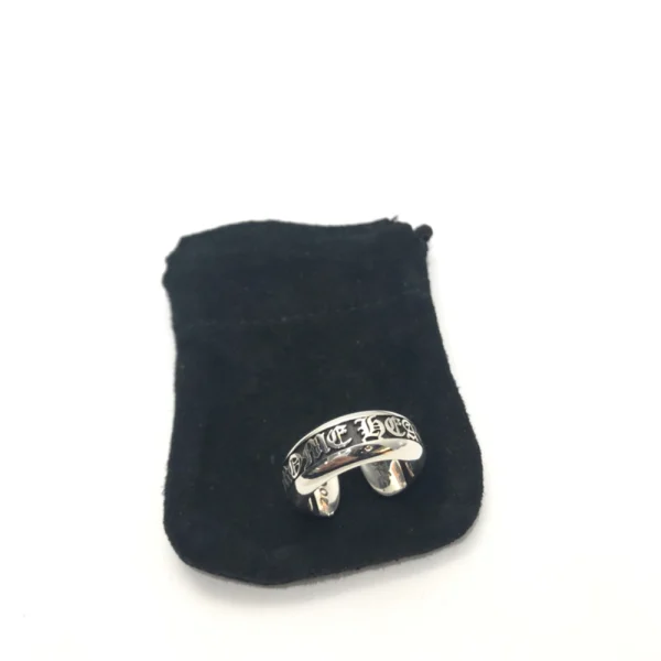 Chrome Hearts Scroll Ring with small label design in sterling silver, featuring engraved gothic branding.