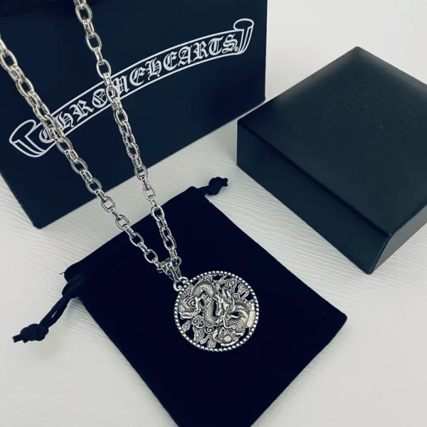 Chrome Hearts silver necklace featuring bold gothic pendant and sterling silver chain.