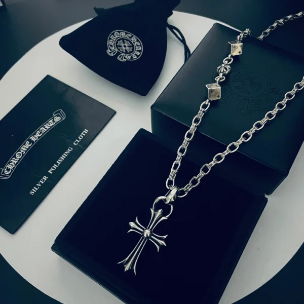 Chrome Hearts small cross pendant necklace with bail, crafted in sterling silver with gothic detailing.