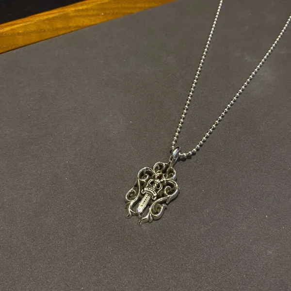 Chrome Hearts Vine Dagger pendant necklace in sterling silver with intricate gothic detailing.