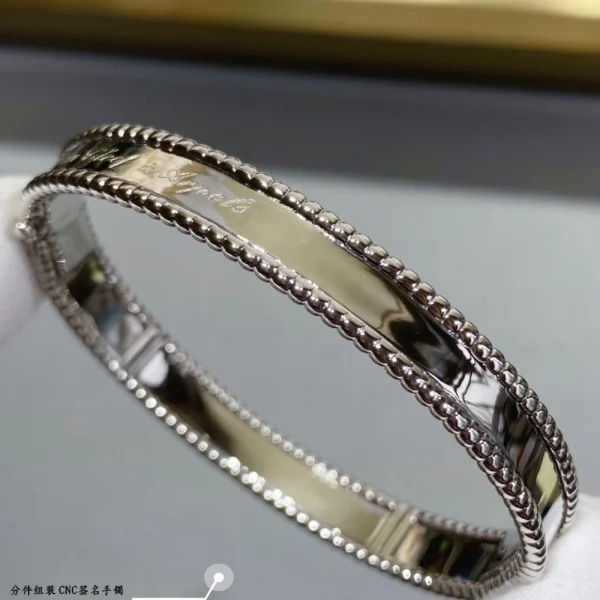 Perlée Signature bracelet by Van Cleef & Arpels – Timeless luxury bangle with polished bead accents at GodJewel