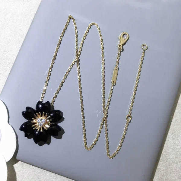 Van Cleef Rose de Noël clip pendant | Jewelry at GodJewel