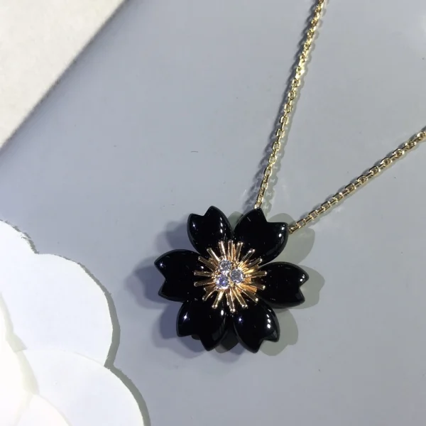 Van Cleef Rose de Noël clip pendant | Jewelry at GodJewel