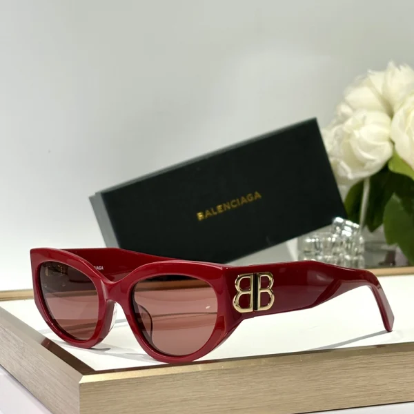 Oversized Balenciaga Bossy sunglasses with angular silhouette and subtle logo on the arm