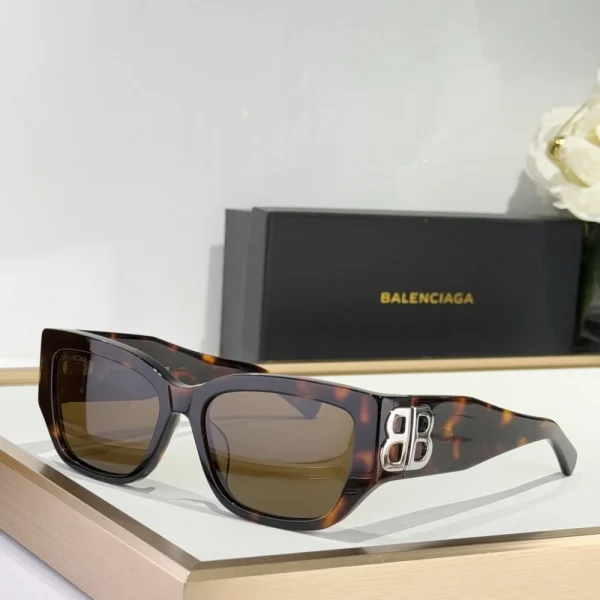 Balenciaga Eyewear cat-eye sunglasses displayed on neutral surface with soft shadows