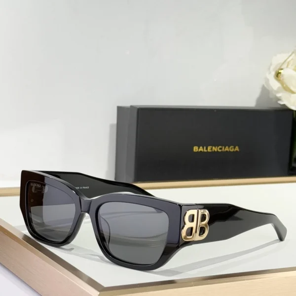 Close-up of Balenciaga cat-eye sunglasses showcasing polished acetate frame and subtle branding