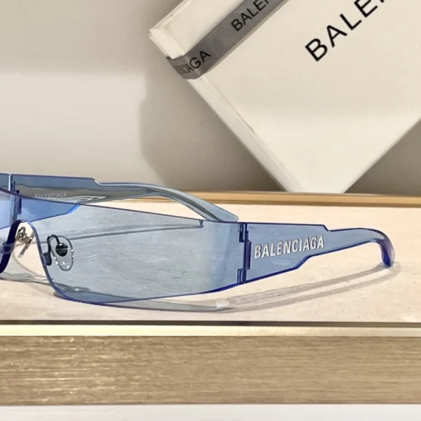 Close-up of Balenciaga Mono sunglasses with engraved logo and sharp rectangular edges