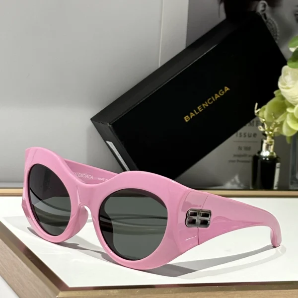 Luxury Balenciaga round-frame sunglasses featuring minimalist design and high-gloss finish