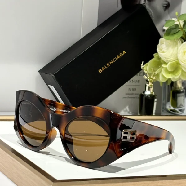 Vintage-inspired Balenciaga round sunglasses blending classic shape with modern attitude
