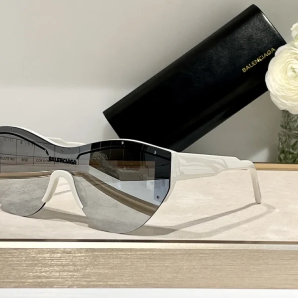 Close-up of Balenciaga Ski cat-eye sunglasses with sharp angles and reflective lens finish