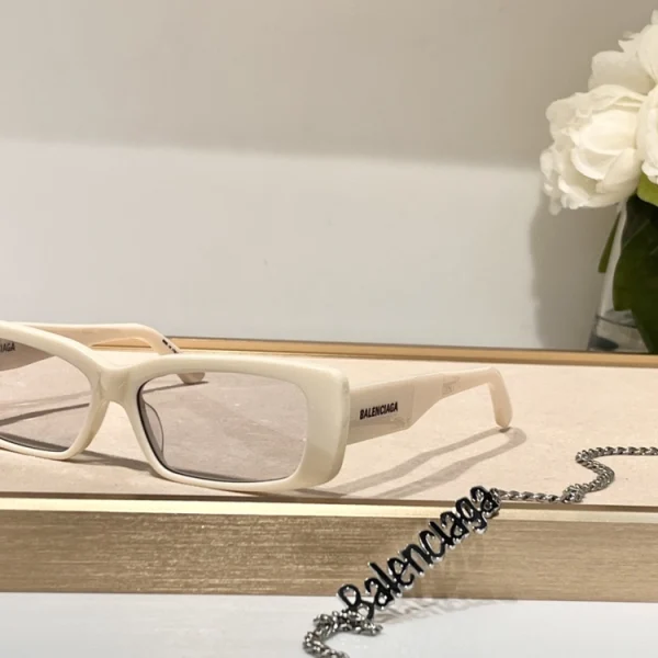 Balenciaga unisex sunglasses with modern frame design and logo on temples