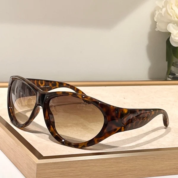 Balenciaga Swift oval sunglasses blending minimalist design with futuristic elegance