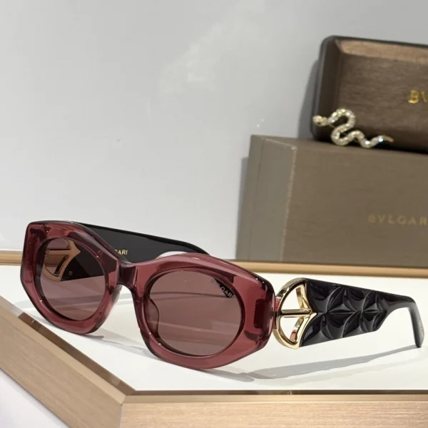 Bvlgari Calla sunglasses resting on a soft white surface with branded case in the background