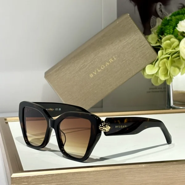 Iconic Bvlgari Serpenti sunglasses displayed upright with gradient lenses reflecting natural light