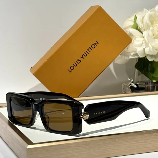 Luxurious Bvlgari Serpenti sunglasses with sculptural temple design and gradient shield-style lenses