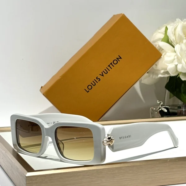 Detailed shot of Bvlgari Serpenti sunglasses showing the signature snake-inspired hinge and sleek profile