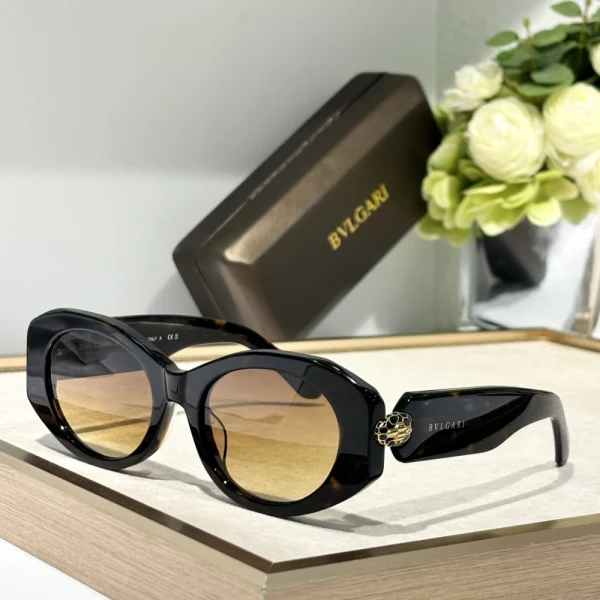 Bvlgari Serpenti sunglasses photographed in soft natural light, emphasizing gold-tone accents and sleek design