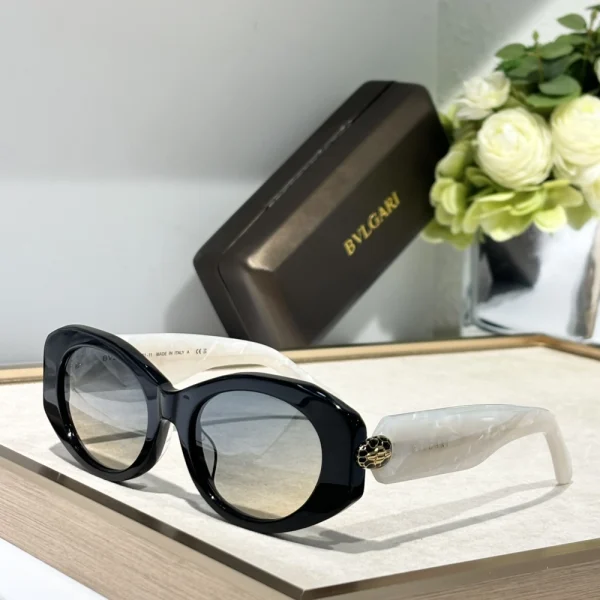 Flat lay of Bvlgari Serpenti eyewear with premium packaging – statement luxury accessory
