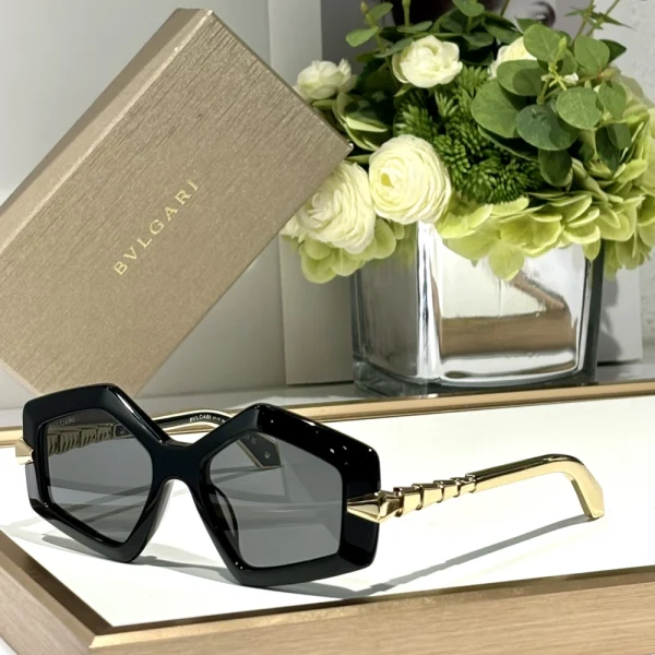 Close-up of Bvlgari Serpenti sunglasses with sculpted serpent-inspired frame and gold accents