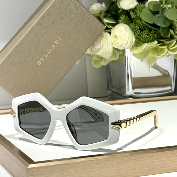 Bvlgari Serpenti sunglasses photographed under soft light, revealing textured metal details