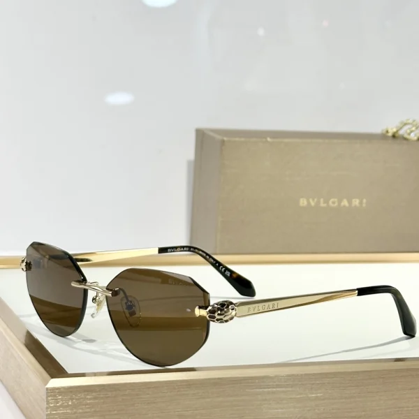 Bvlgari Serpenti sunglasses flat laid next to branded hard case and cleaning cloth, emphasizing luxury presentation