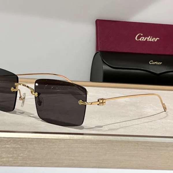 Cartier C de Cartier Precious Sunglasses laid flat on beige velvet, highlighting precious metal detailing and lens color