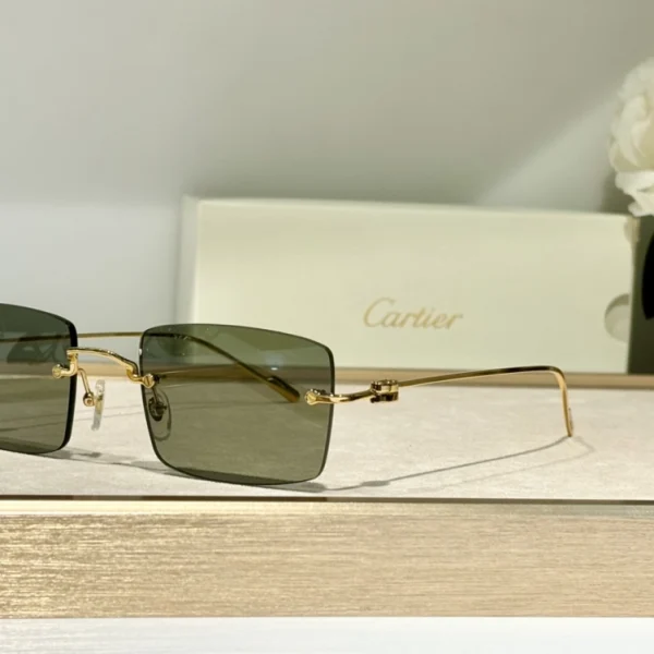 Cartier C de Cartier Precious Sunglasses resting on a marble tabletop, reflecting premium materials and timeless design