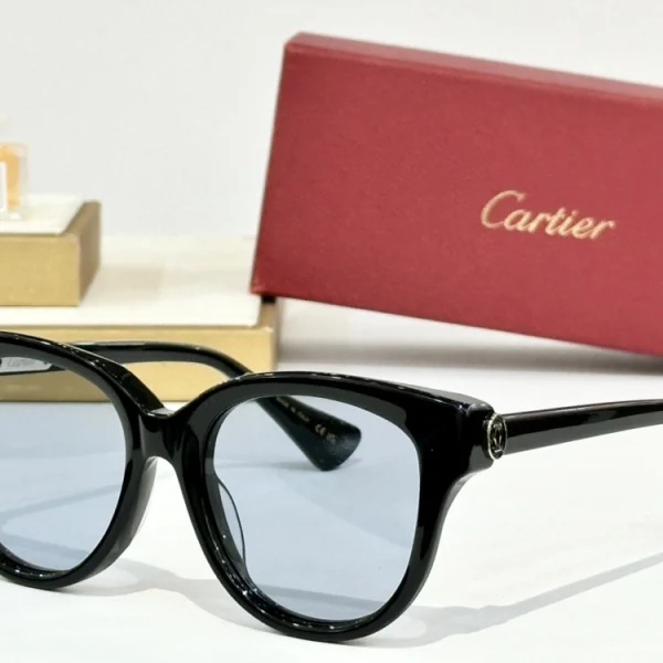 Close-up of Cartier C de Cartier sunglasses showing curved temple arms with iconic C-shaped accents