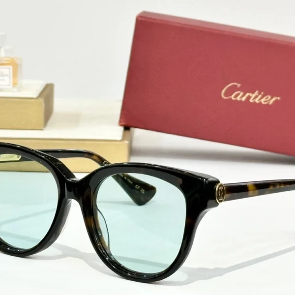 Refined C de Cartier sunglasses resting on white surface, showcasing luxurious construction